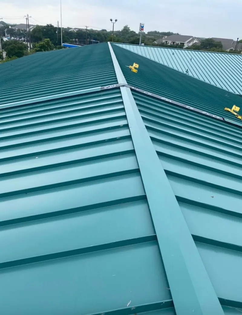 Green commercial metal roof ridge and valley for Metal Roof Repair in Monument