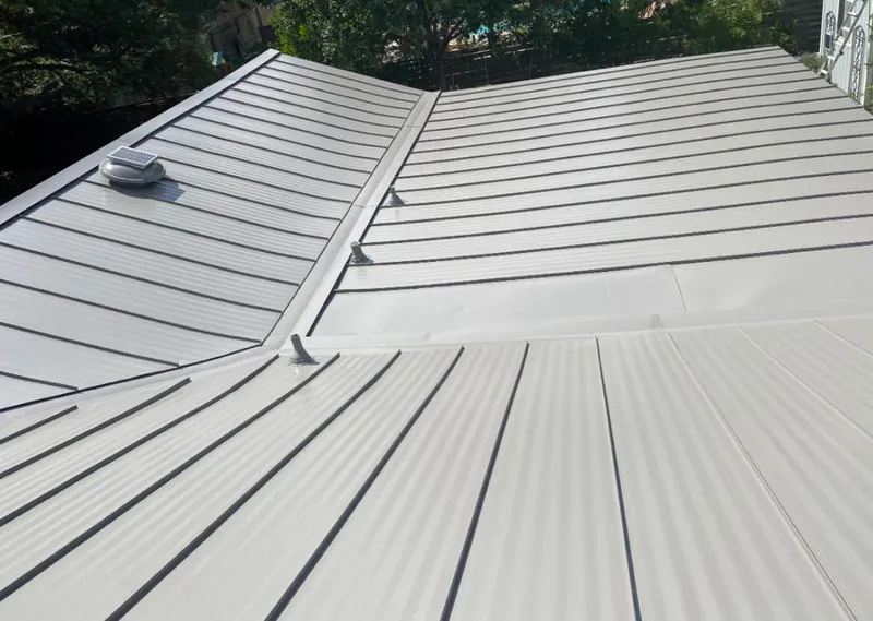 Solar attic fan installed on a metal roof for Roof Ventilation in Monument